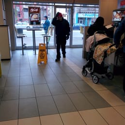 a woman pushing a baby in a stroller a woman pushing a baby in a stroller