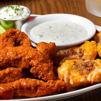 99 Restaurants - a plate of chicken wings with ranch dip and celery - American Near Me - Wareham, Massachusetts 99 Restaurants - a plate of chicken wings with ranch dip and celery - American Near Me - Wareham, Massachusetts