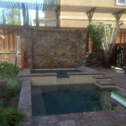 Swim spa pool and 12 person hot tub with rain water wall Swim spa pool and 12 person hot tub with rain water wall