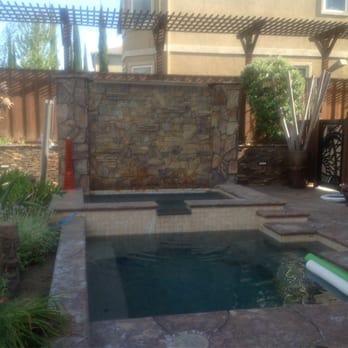 Logan Pools - Swim spa pool and 12 person hot tub with rain water wall - Landscaping Near Me - Brentwood, California Logan Pools - Swim spa pool and 12 person hot tub with rain water wall - Landscaping Near Me - Brentwood, California