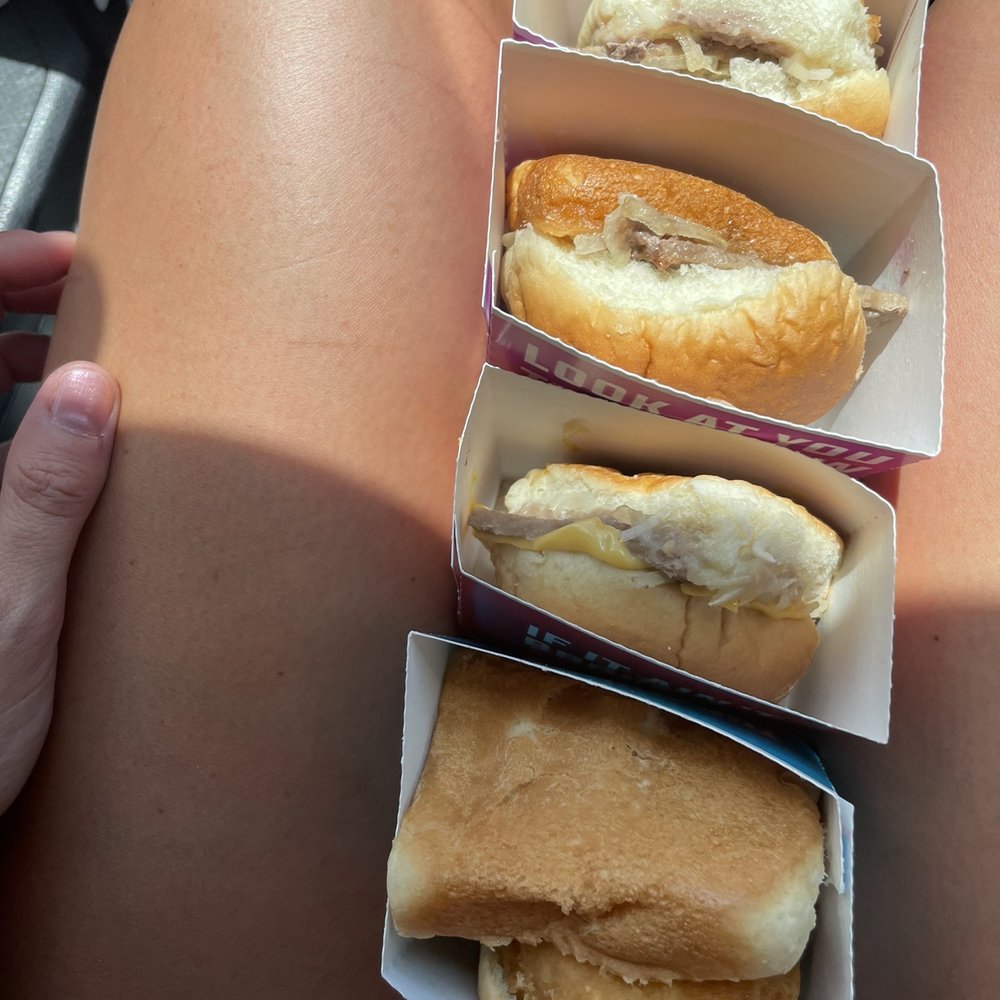 a woman's legs with four hot dogs a woman's legs with four hot dogs