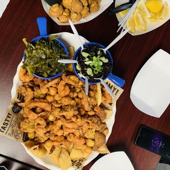 Singleton's Seafood Shack - Fried seafood platter for two, fried mushrooms, collard greens, rice and beans - Seafood Near Me - Jacksonville, Florida Singleton's Seafood Shack - Fried seafood platter for two, fried mushrooms, collard greens, rice and beans - Seafood Near Me - Jacksonville, Florida