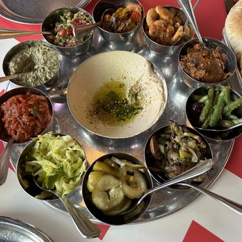 Laser Wolf - The Salatim that I can't even describe how amazing. There are some spicy, creamy, briny, and amazing flavors! It is also refillable! - Middle Eastern Near Me - Philadelphia, Pennsylvania