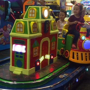 Chuck E. Cheese - a child riding a toy train - Pizza Near Me - Goldsboro, North Carolina Chuck E. Cheese - a child riding a toy train - Pizza Near Me - Goldsboro, North Carolina