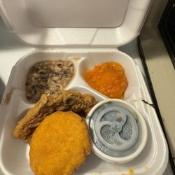Sharon's Cafe - Fried pork chop , green, yams and black eyed peas .