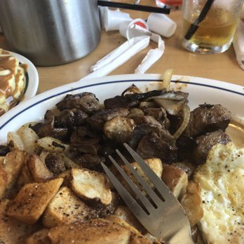 IHOP - Steak Tips eggs over medium and potatoes. This was my sisters plate it was WARM! - American Near Me - Carrollton, Georgia