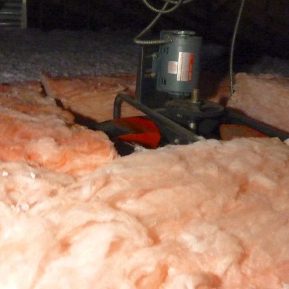 Whole-house attic fan was insulated and isolated from blown in insulation Whole-house attic fan was insulated and isolated from blown in insulation