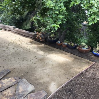 Connor's Landscape - Added railroad ties and DG behind the garage - Irrigation Near Me