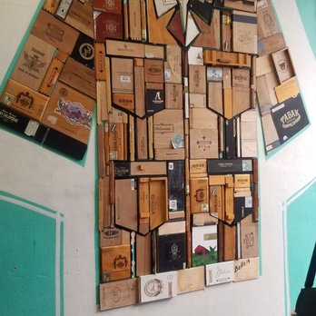 Little Havana Tours - Exhibit for a future open-air museum. This Guayabera is made from old cigar boxes - Walking Tours Near Me - Miami, Florida Little Havana Tours - Exhibit for a future open-air museum. This Guayabera is made from old cigar boxes - Walking Tours Near Me - Miami, Florida