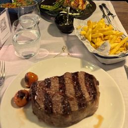 Ribeye, French fries, salmon
