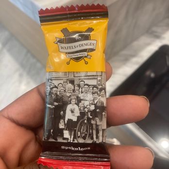 Wafels & Dinges - a hand holding a waffle bar - Waffles Near Me - New York, New York Wafels & Dinges - a hand holding a waffle bar - Waffles Near Me - New York, New York