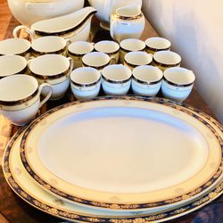 Royalty fine porcelain dinnerware with 14kt gold rim.
