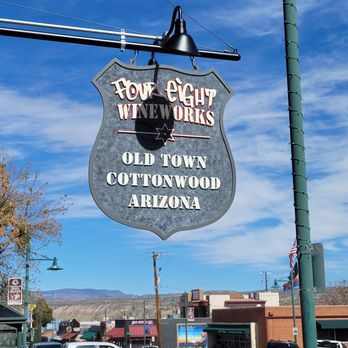 Four Eight Wineworks - a sign for the town of cottonwood - Wine Bars Near Me - Cottonwood, Arizona