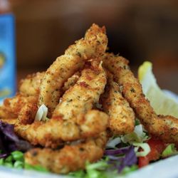 Fishwife - Calamari strips, breaded upon order (Without tentacles) Served with our Caribbean tartar sauce.