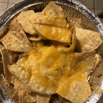 Costa Vida - a hand holding a bowl of nachos - Mexican Near Me - Spanish Fork, Utah