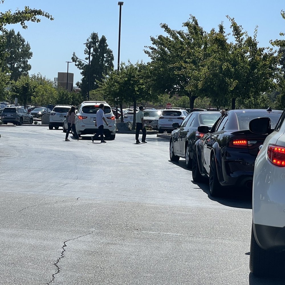 Costco Gasoline - Long and congested line filled with pedestrians and vehicles trying to cross. - Gas Stations Near Me - Alhambra, California Costco Gasoline - Long and congested line filled with pedestrians and vehicles trying to cross. - Gas Stations Near Me - Alhambra, California