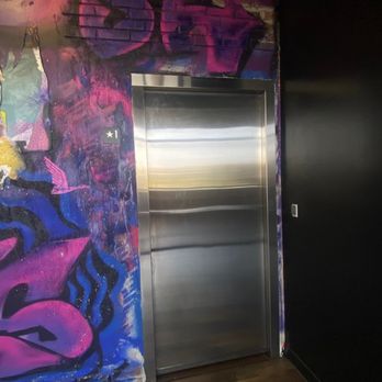 Wild Goose Escape Rooms - Irvine - The elevator door entrance to Elevate: Sky Lounge - Escape Games Near Me - Irvine, California Wild Goose Escape Rooms - Irvine - The elevator door entrance to Elevate: Sky Lounge - Escape Games Near Me - Irvine, California