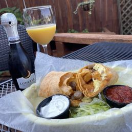 Breakfast burrito $8 Mimosa with a whole little bottle of bubbly! Only $7