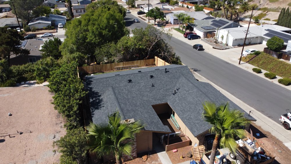 Slide of J&E Roofing Services