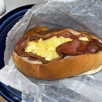 Manna One - Bacon and egg on soft roll - Bakeries Near Me - New York, New York Manna One - Bacon and egg on soft roll - Bakeries Near Me - New York, New York