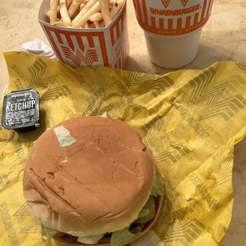 Whataburger - a hamburger and fries on a table - Fast Food Near Me - Laredo, Texas
