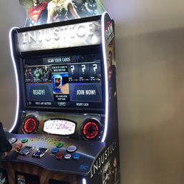 Video game that spits out a collectors card if you win.
