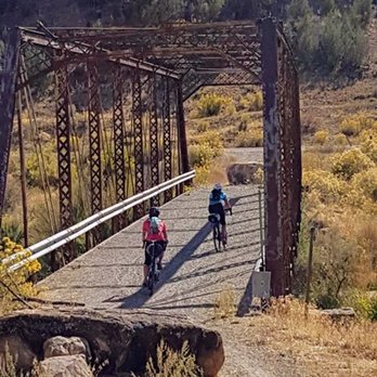 Brown Cycles - We are crossing the decommissioned bridge as part of the Gravel Grinder route offered through the San Juan Hut System. - Bikes Near Me - Grand Junction, Colorado
