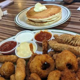Sampler platter and stack of pancakes Sampler platter and stack of pancakes