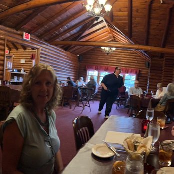 Williams's Pine Gables - a group of people sitting at a table in a log cabin - Supper Clubs Near Me - Eagle River, Wisconsin