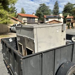 Great Dane Heating & Air Conditioning - My old AC unit being sent off to retirement after 19 years of service. Its replacement, from Great Dane, is much nicer and brand new!