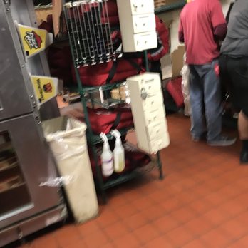 Pizza Hut - Mad house as employees scramble to fill orders on a rainy Saturday night in December 2017 - Pizza Near Me - Austin, Texas
