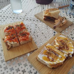 Hotel Madrid - Pan con Tomate (left), Hot Honey Tosta (bottom right), and Pimento Cheese board (upper right)