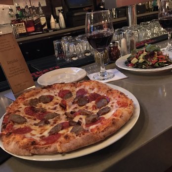 Flavio Restaurant DC - Pizza sausage, salad, and red wine - Italian Near Me - Washington, DC, District of Columbia
