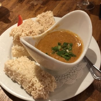 The Elephant Walk - Nataing - Pork Simmered in Coconut Milk w/Garlic, Peanut w/Crispy Rice Cakes - Cambodian Near Me - Boston, Massachusetts The Elephant Walk - Nataing - Pork Simmered in Coconut Milk w/Garlic, Peanut w/Crispy Rice Cakes - Cambodian Near Me - Boston, Massachusetts