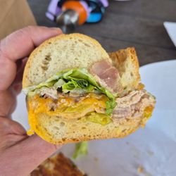 Angelo's Wine Country Deli - side of the porchetta sandwich so you can see the amount of meat in a deli sandwich