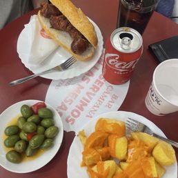 Chorizo sandwich and patatas bravas Chorizo sandwich and patatas bravas