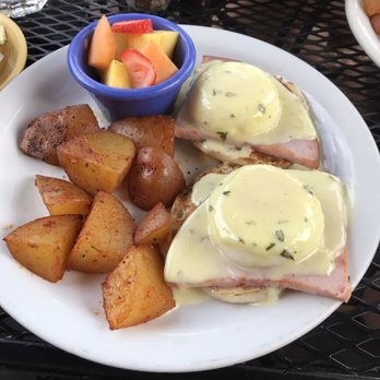 Wildflower Cafe - Eggs Benedict cooked to perfection with a side of seasoned potatoes and fresh cut fruit. - Breakfast & Brunch Near Me - Redondo Beach, California Wildflower Cafe - Eggs Benedict cooked to perfection with a side of seasoned potatoes and fresh cut fruit. - Breakfast & Brunch Near Me - Redondo Beach, California