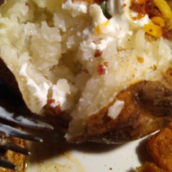 Outback Steakhouse - Outback's dressed baked potato: rate this potato an "A-." Fluffy inside and crispy skin outside. - Steakhouses Near Me - Las Cruces, New Mexico Outback Steakhouse - Outback's dressed baked potato: rate this potato an "A-." Fluffy inside and crispy skin outside. - Steakhouses Near Me - Las Cruces, New Mexico