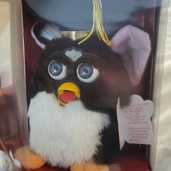 Pudik’s Antiquities & More - 1999 graduation furby