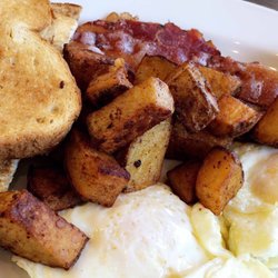 Hello Gorgeous Boutique - 2 eggs, home fries, roast, and bacon. The peach jam was delicious! (Not pictured)