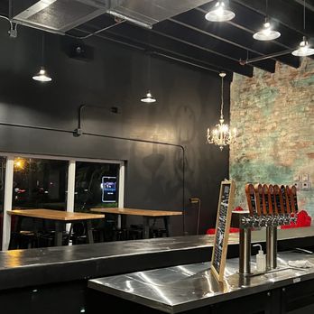 Black Flamingo - a bar with a metal counter and stools - Breweries Near Me - Oakland Park, Florida Black Flamingo - a bar with a metal counter and stools - Breweries Near Me - Oakland Park, Florida