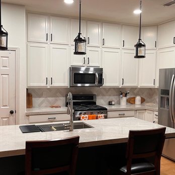 Sanco Construction - a kitchen with stainless steel appliances - General Contractors Near Me