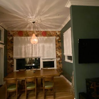 Miann Builders - Wall paper, paint, molding, and ceiling medallion in dining room. - General Contractors Near Me