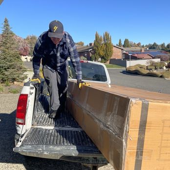 Tired of Trash - Cameron unloading the sideboard. - Junk Removal & Hauling Near Me