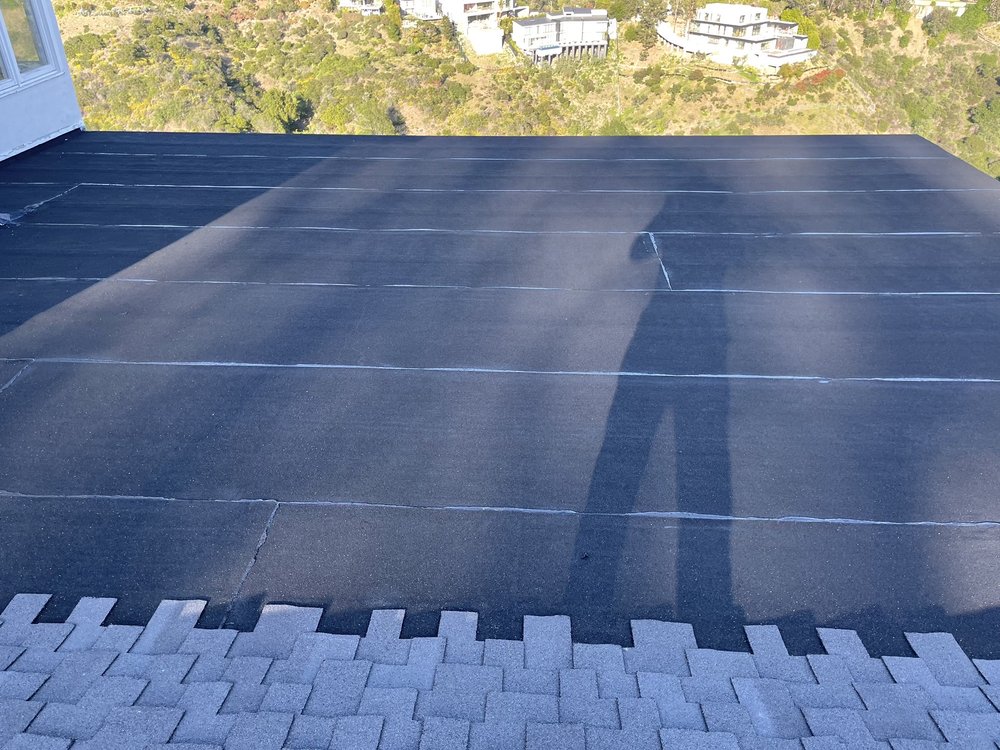 Slide of Goliath Roofing