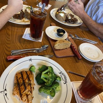 Saltgrass Steak House - Grilled Salmon with a side of Broccoli, with 2 orders of Pat's Ribeye with a baked fully loaded baked potato. - Steakhouses Near Me - Amarillo, Texas Saltgrass Steak House - Grilled Salmon with a side of Broccoli, with 2 orders of Pat's Ribeye with a baked fully loaded baked potato. - Steakhouses Near Me - Amarillo, Texas