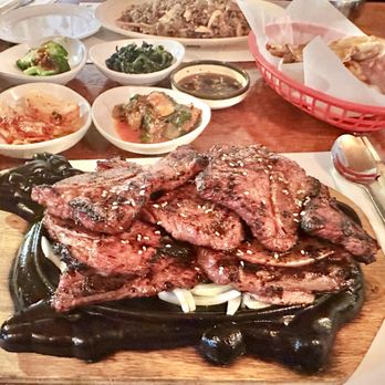 Arirang Korean Restaurant - Stacks and stacks of meat served on a sizzling cow platter. - Korean Near Me - San Antonio, Texas
