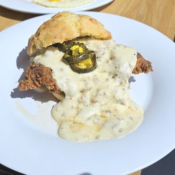 Vicious Biscuit - IG: tonylameats |VICIOUS Cheddar jalapeño biscuit, crispy fried chicken, maple sausage gravy, cowboy candy, maple syrup drizzle - Southern Near Me - Gonzales, Louisiana