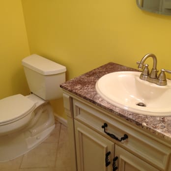 Erby Contracting - a bathroom with a sink and toilet - General Contractors Near Me - Mechanicville, New York