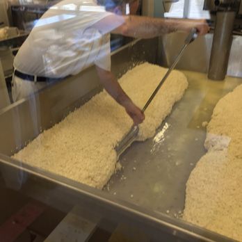 Le Métayer - a man working in a bakery - Cheese Shops Near Me - Napierville, Quebec